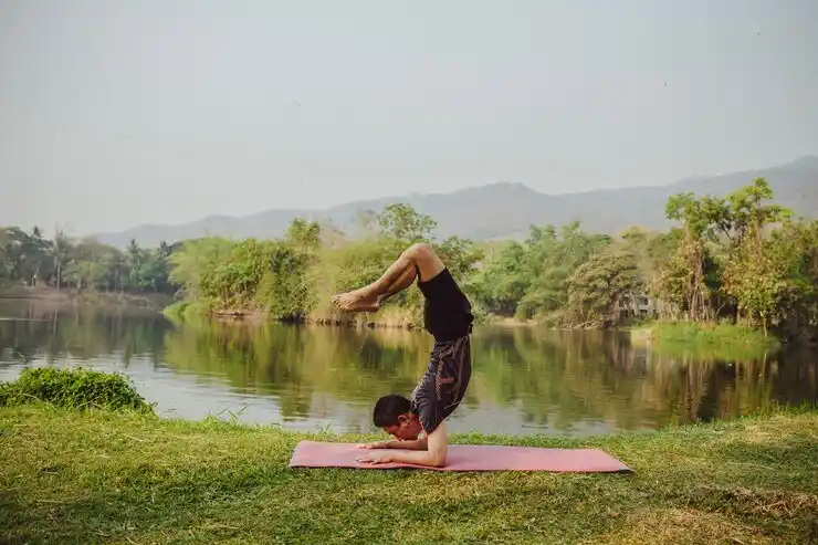 Finding inner peace with yoga by a tranquil lake
